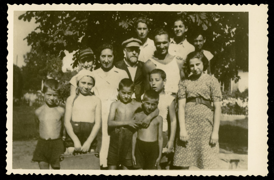Janusz Korczak with his pupils and employees of the Orphans' Home at the DS Różyczka summer camp, Wawer (nowadays Marysin Wawerski), 1938; original prints can be found in Israel at the Ghetto Fighters’ House, photo courtesy of the Korczakianum Centre for Documentation and Research in Warsaw